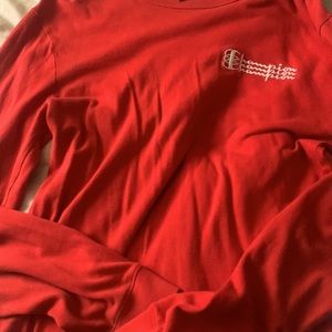 Woman’s red long sleeve top